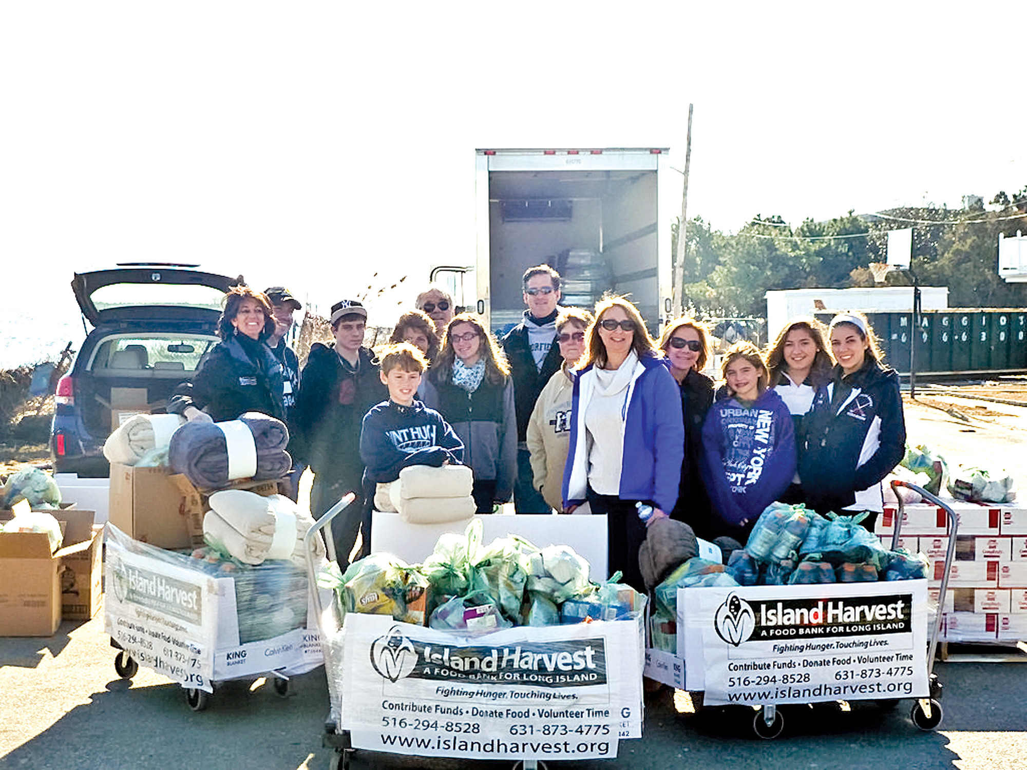 Island Harvest President and CEO Randi Shubin Dresner, far left, staff and volunteers aided storm victims in Long Island's hardest hit locations.