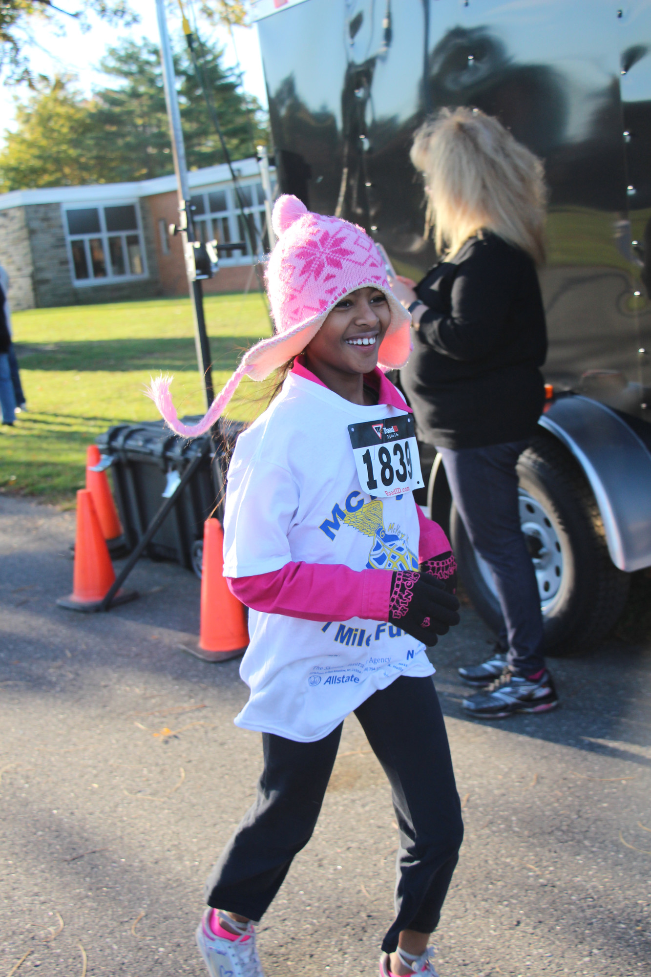 Srinidhi Chinnadurai, 9, of McVey Elementary School, couldn’t help but flash a smile as she crossed the finish line for the fun run.