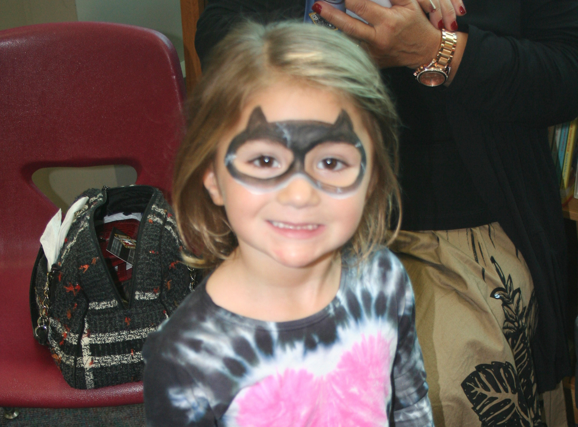 Julianna Berland had her face painted so she could be Catwoman for a day.