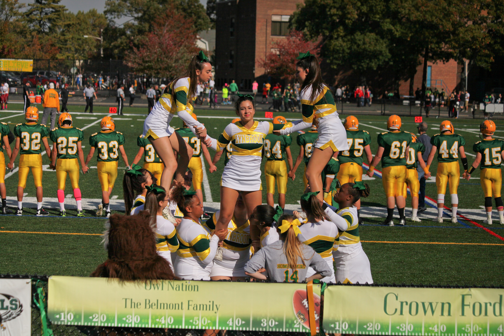 The Lynbrook High School cheerleaders perform for the crowd before the start of the game.