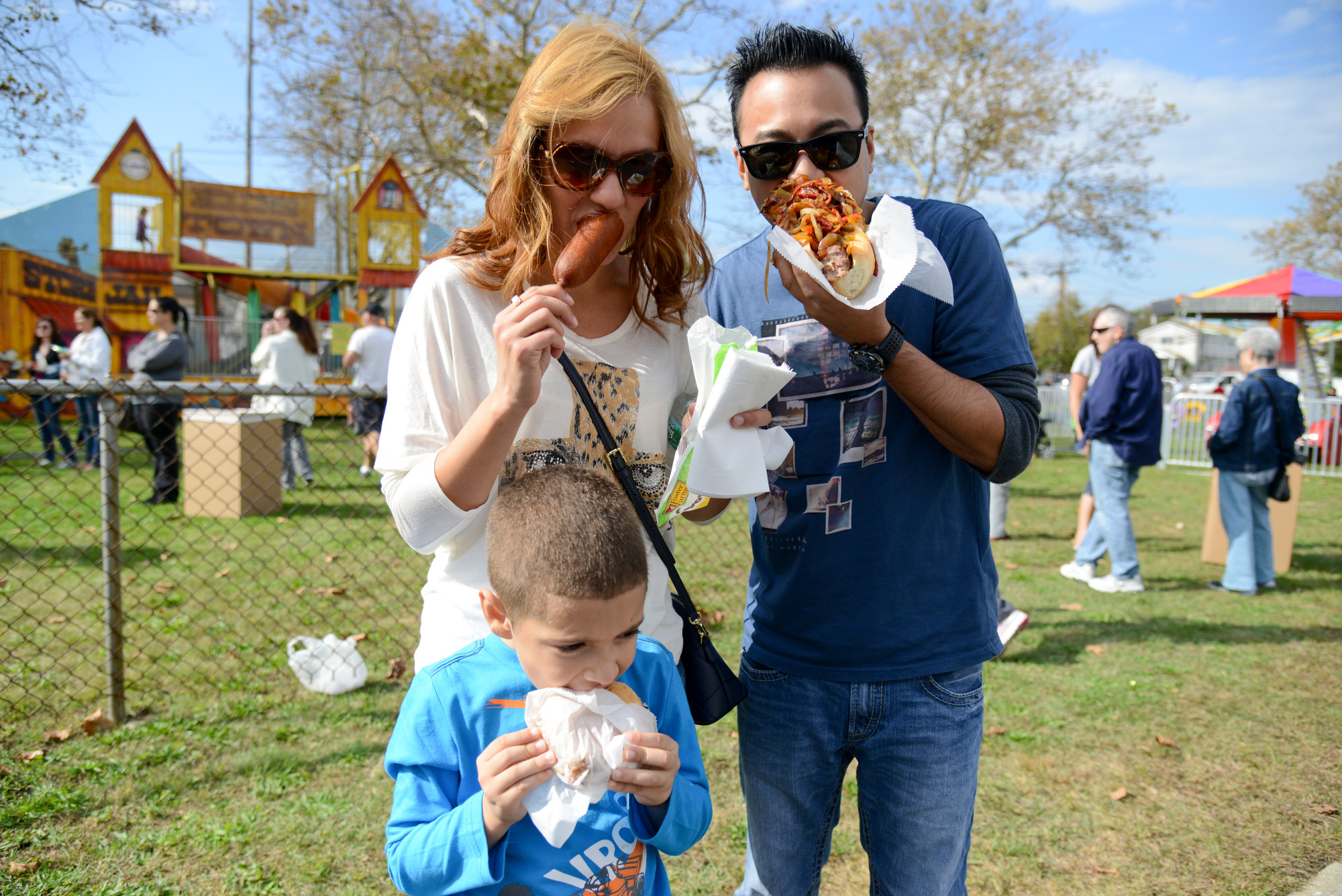 Katia, Marcos and Leo Mendez enjoyed what they saw, and tasted, at the Oceanside Chamber of Commerce fair.