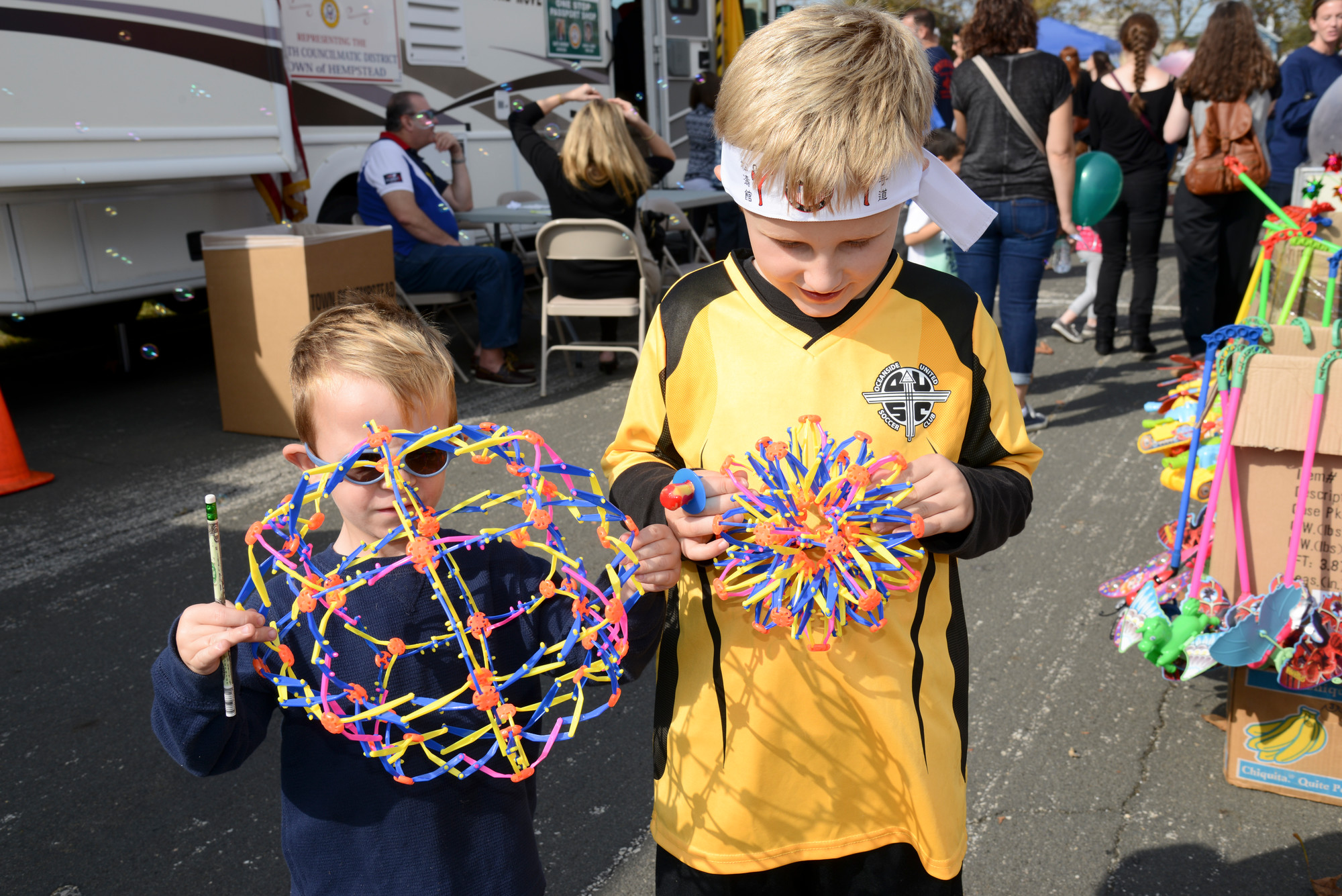 Liam Gausman, 4, and his brother Keiran, 6, had a hands-on experience at the chamber fair on Oct. 18.