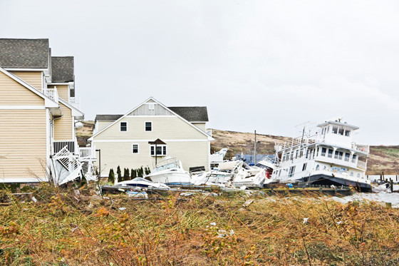 While many boats were swept away in the storm, some, like these in Island Park, were thrust onto land, settling next to waterfront homes.