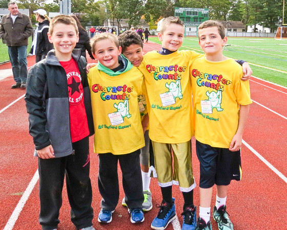 Manor second-graders were all smiles after jogging the track.