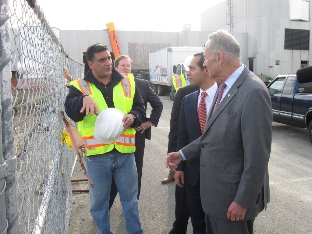 U.S. Sen. Charles Schumer, far right, and HUD Development Secretary Julian Castro received a tour of the plant from employees