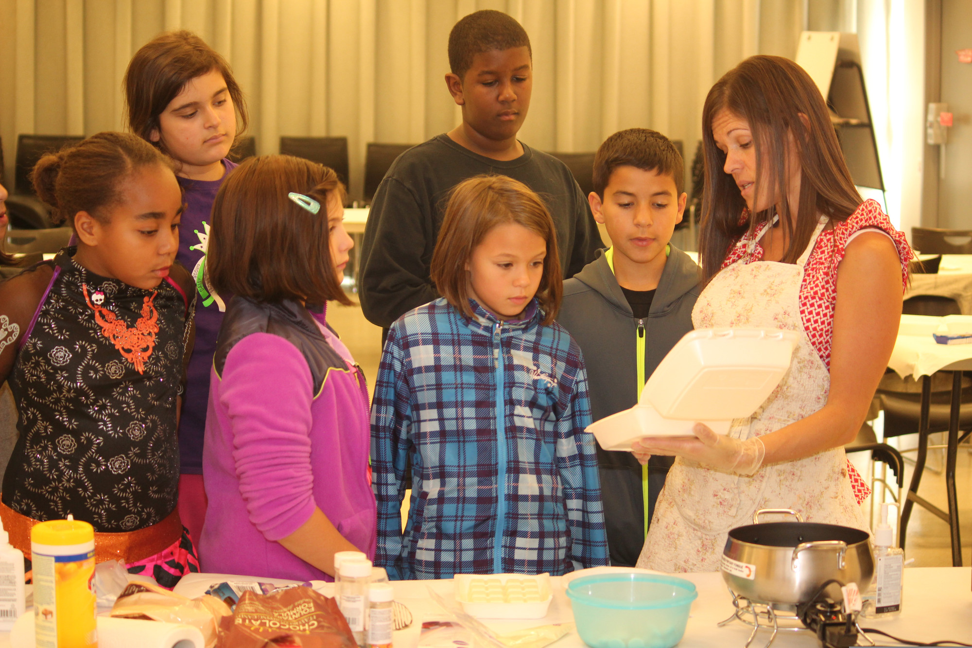 Katherine Giovalanis, right, paid a visit to the Baldwin Public Library last month to teach children how to decorate chocolate covered oreos.