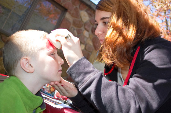 In the Kid’s Area, James Kearney got his face painted by volunteer Kristen Giannuzzi.