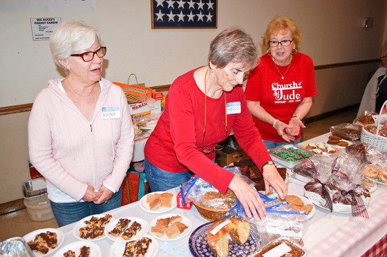 St. Jude Volunteers, from left, Kathy Gavin, Debbie Smith and Marilyn Zaun, worked the baked good table.