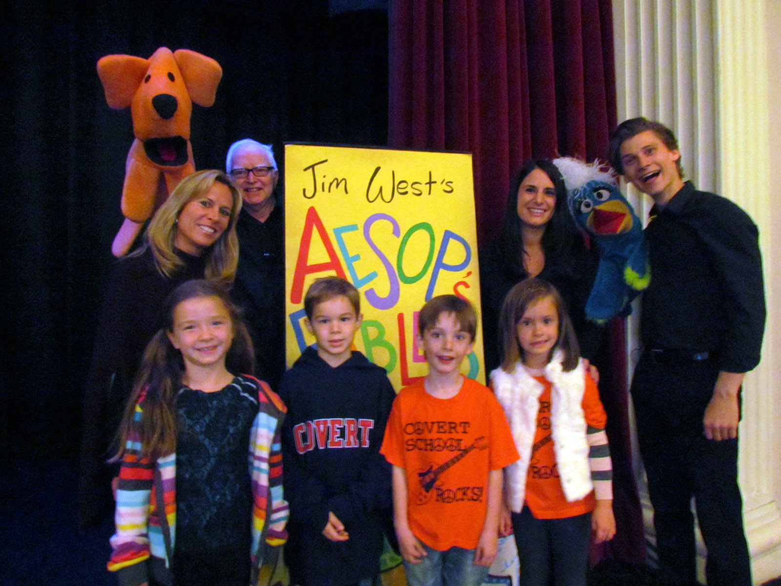 Teachers Valerie Sprague and Antoinette Morgan, and first graders Julie Coles, Joshua DePaoli, Connor Erickson and Liana McCarthy posed with puppeteers Jim West and Ian Antal before the show.