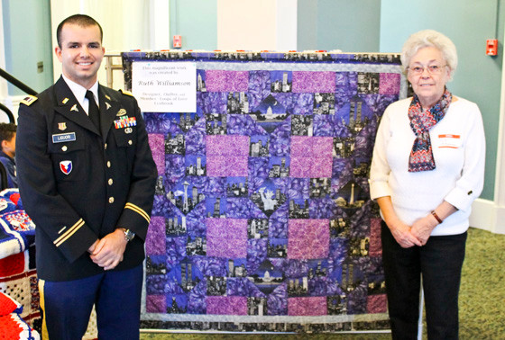Loops of Love member Ruth Williamson personally presented LT. Liguori with his own blanket.
