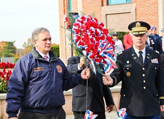 Nassau County Executive Ed Mangano, Chuck Carlucci and Hon. Terrance Murphy presented the wreath at the county’s Veterans Day ceremony at Eisenhower Park last Sunday.