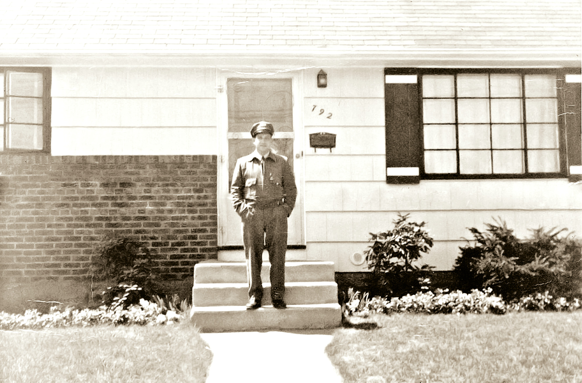 Mallico, then a mailman, outside his North Bellmore home in the early 1960s.