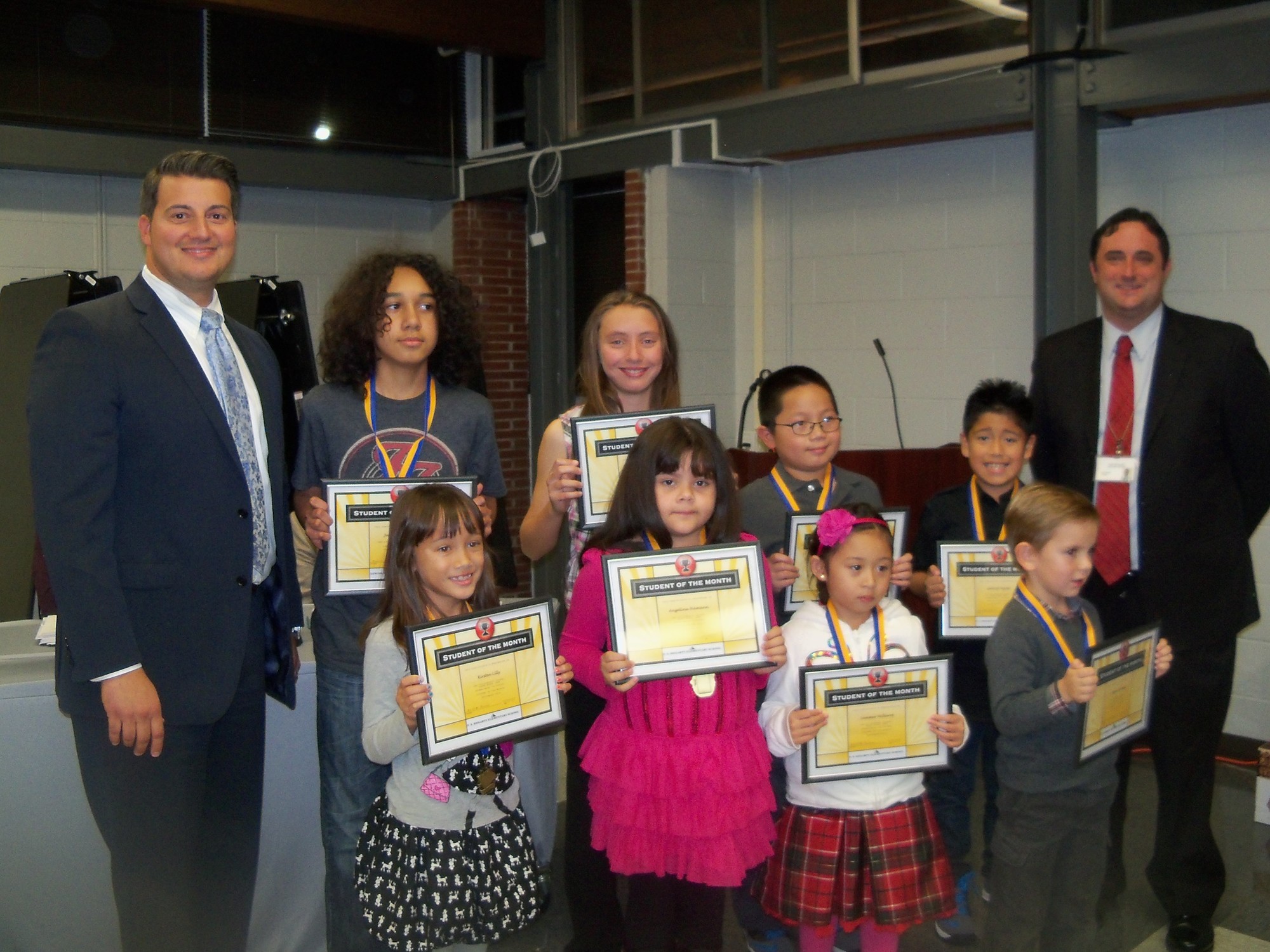 September Student of the Month award winners with their school principals, front row from left: Kirsten Lilly, Angelina Hamann, Summer Millares and Cillian Cantwell. Back row: Lincoln Orens Middle School Principal Vincent Randazzo, Jaylyn Umana, Brooke Yellin, Adam Santa Maria, Gabriel Tejada, and Hegarty School Principal Jacob Russum.