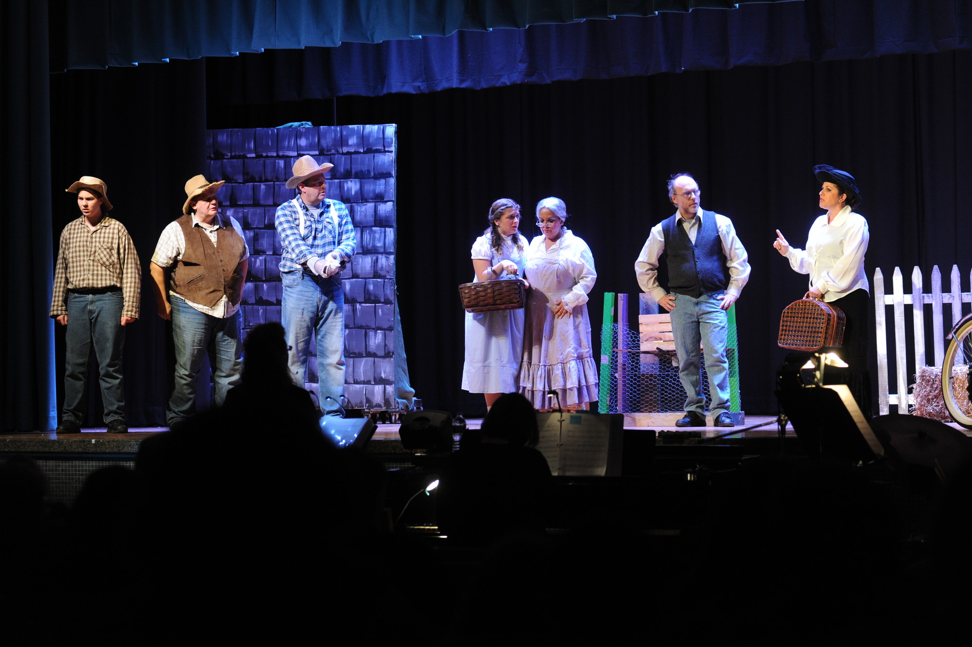 Dorothy Gale, center, played by Marissa Feminella, of Island Park, was confronted on her family’s farm by Almira Gulch, played by her real-life mother, Dana Feminella, far right, who also played the Wicked Witch of the West. Also pictured, from left, were Billy O’Brien, of Valley Stream; Larry Schneider, of Oceanside; Monica Gerand, of Hewlett, and Bobby Newman, of Long Beach.