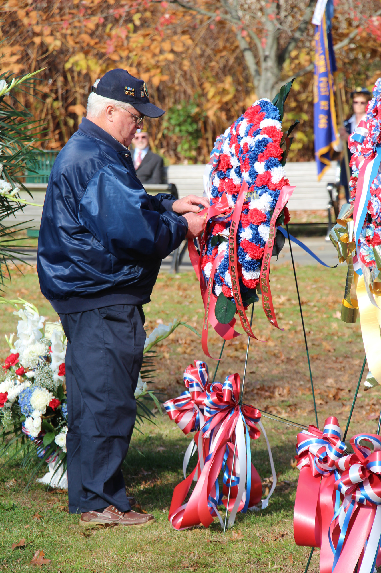 Joseph Keating placed a Merchant Marine ribbon on a wreath.