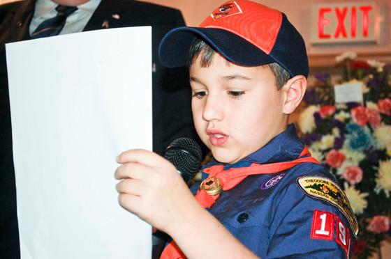 Cub Scout Gabriel Summers read a poem about veterans.