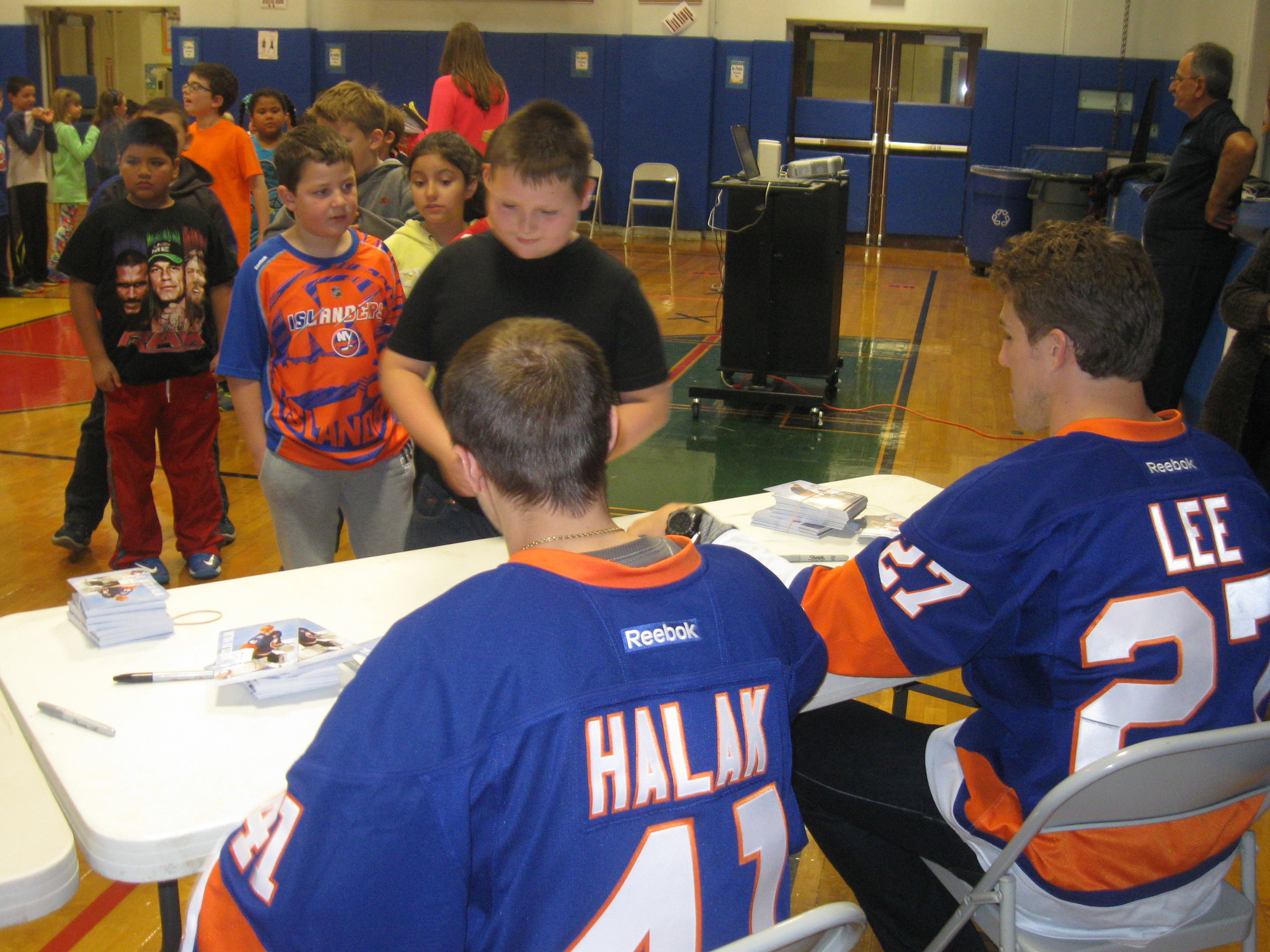 Jaroslav Halak and Anders Lee signed autographs for the students after the assembly.