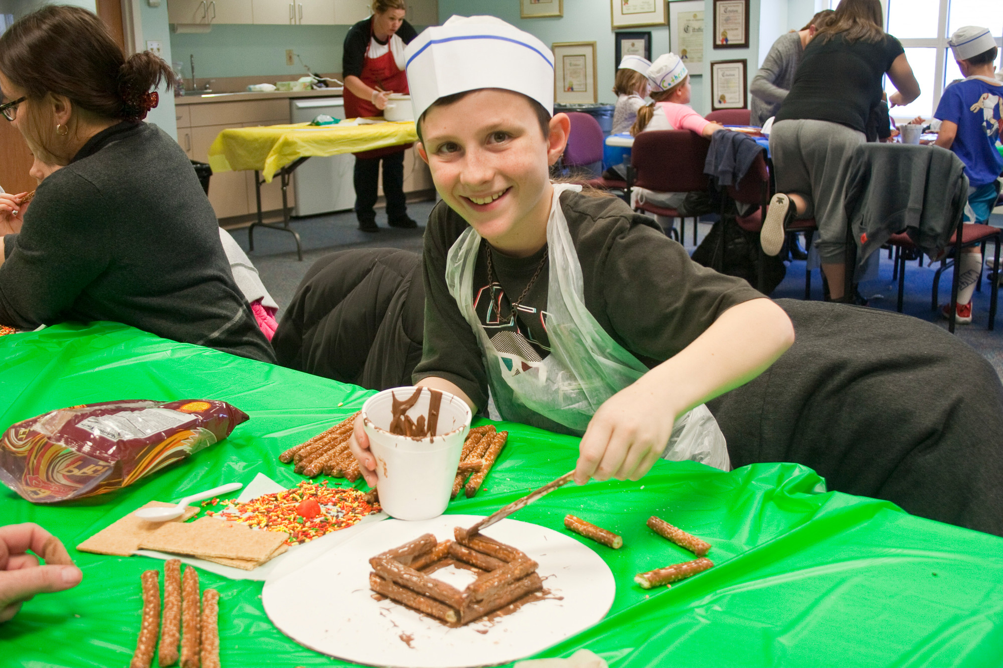 Shane Mulvey, 10, is as excited about making a log cabin as he is about eating it!