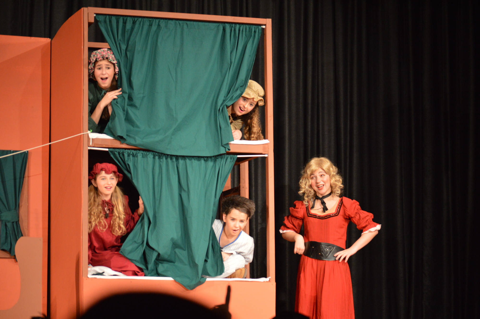 Rebecca Goldfarb, who played Annie Oakley, performs with Mikayla Gross and Thanae Stoupas in the top bunk with Makayla Carlins and Ryan Aizer in the bottom bunk.