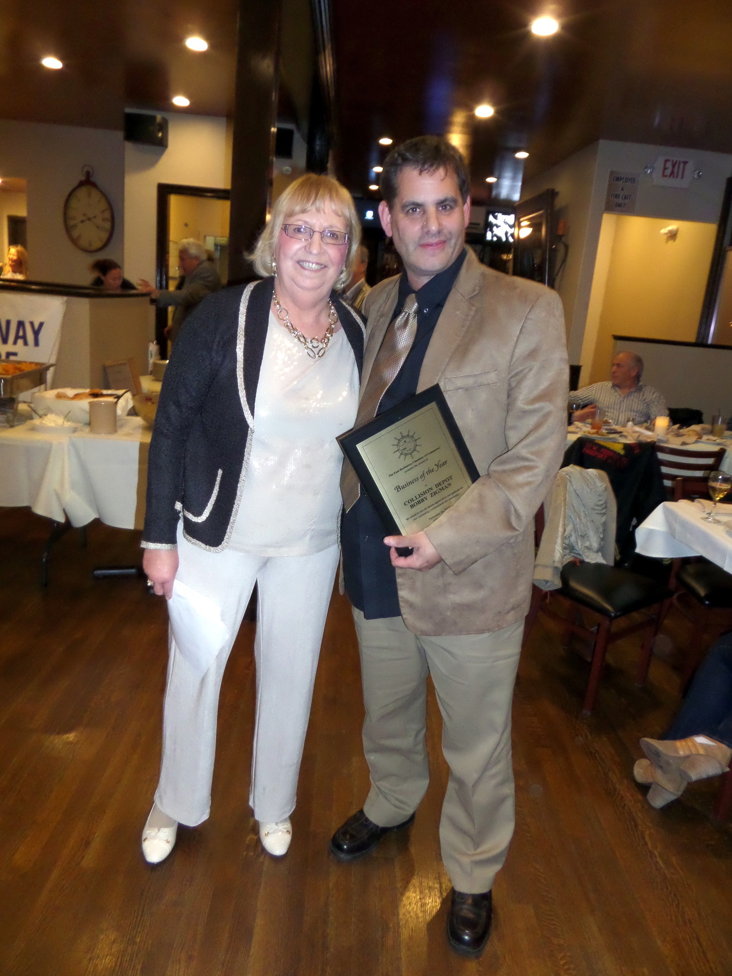 Chamber president Debbie Hirschberg presented Collision Depot owner Bobby Zigman with his plaque at the event, held at Althouse1848 restaurant, on Nov. 20.
