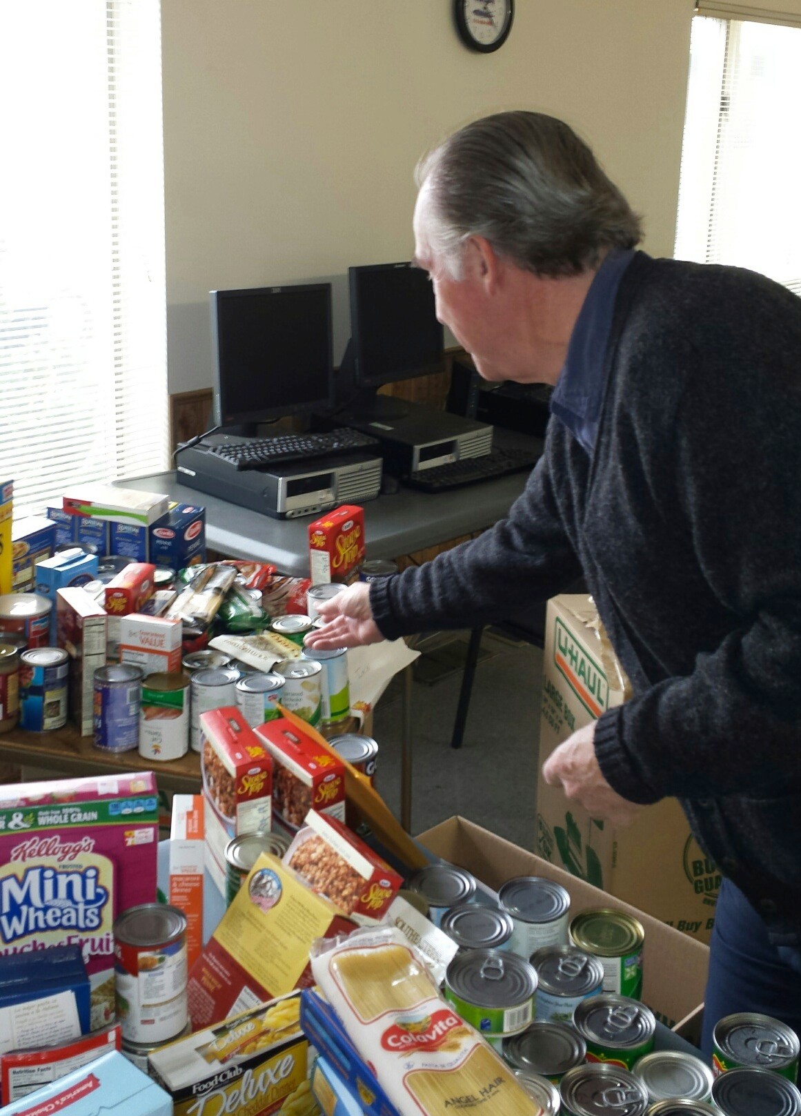 Compagnoni sorted the food items at the Senior Center in East Rockaway.