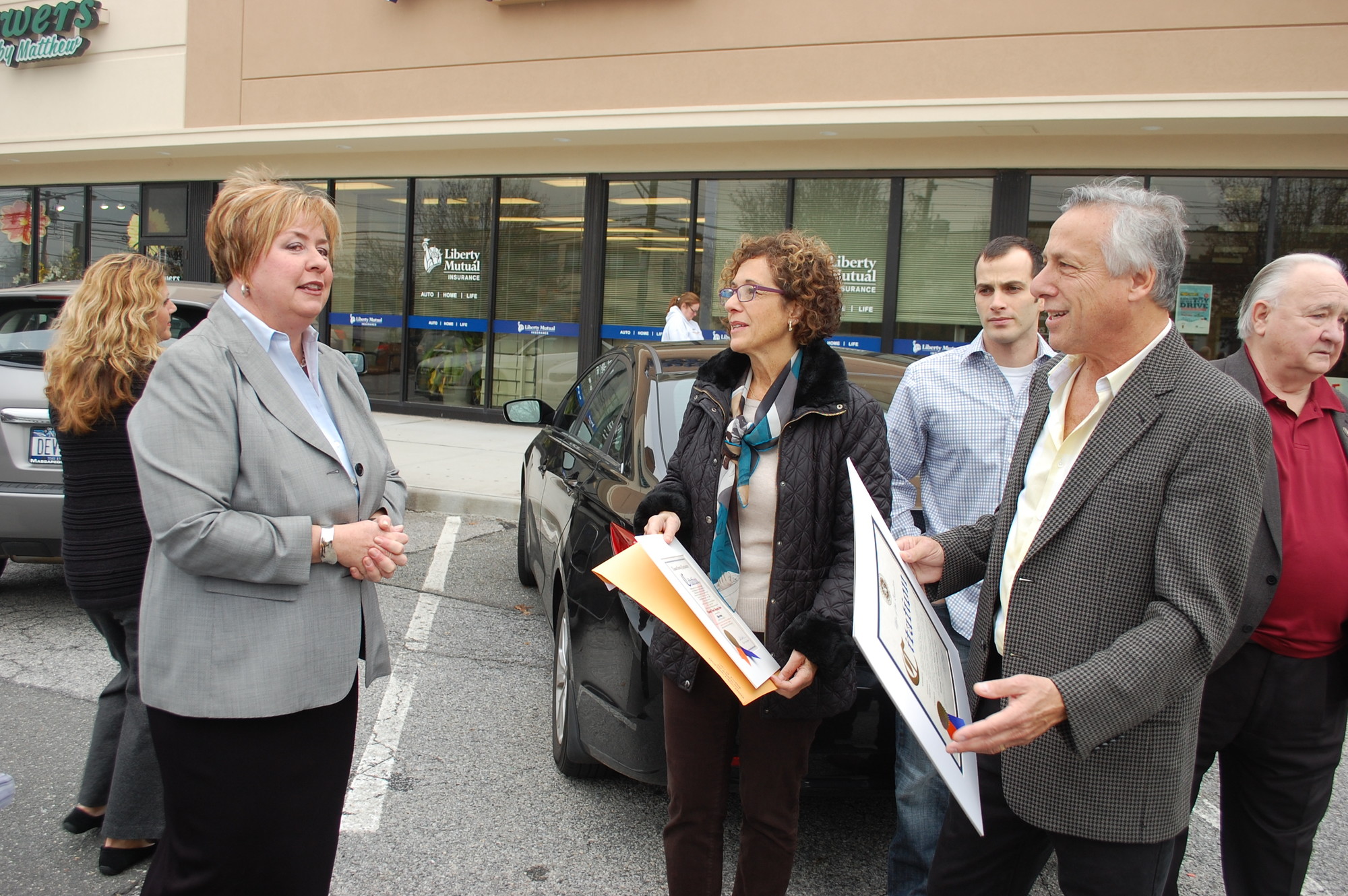 Hempstead Town Supervisor Kate Murray told Wantagh Woods owners Lisa and Rob Gordon that the town would repave the parking lot at the refurbished shopping center.