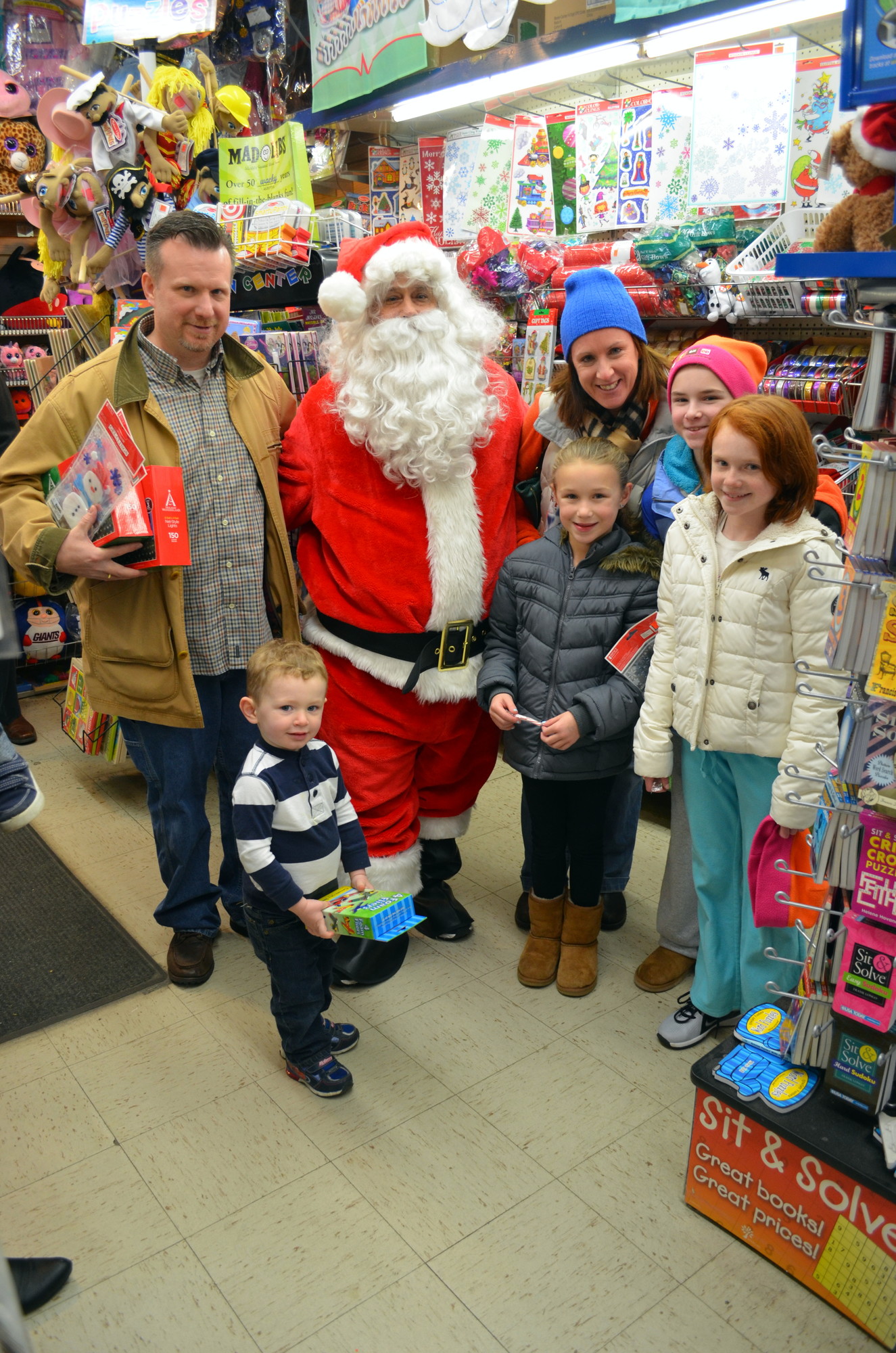 Families flocked to local stores to shop last Saturday — and to see Santa.