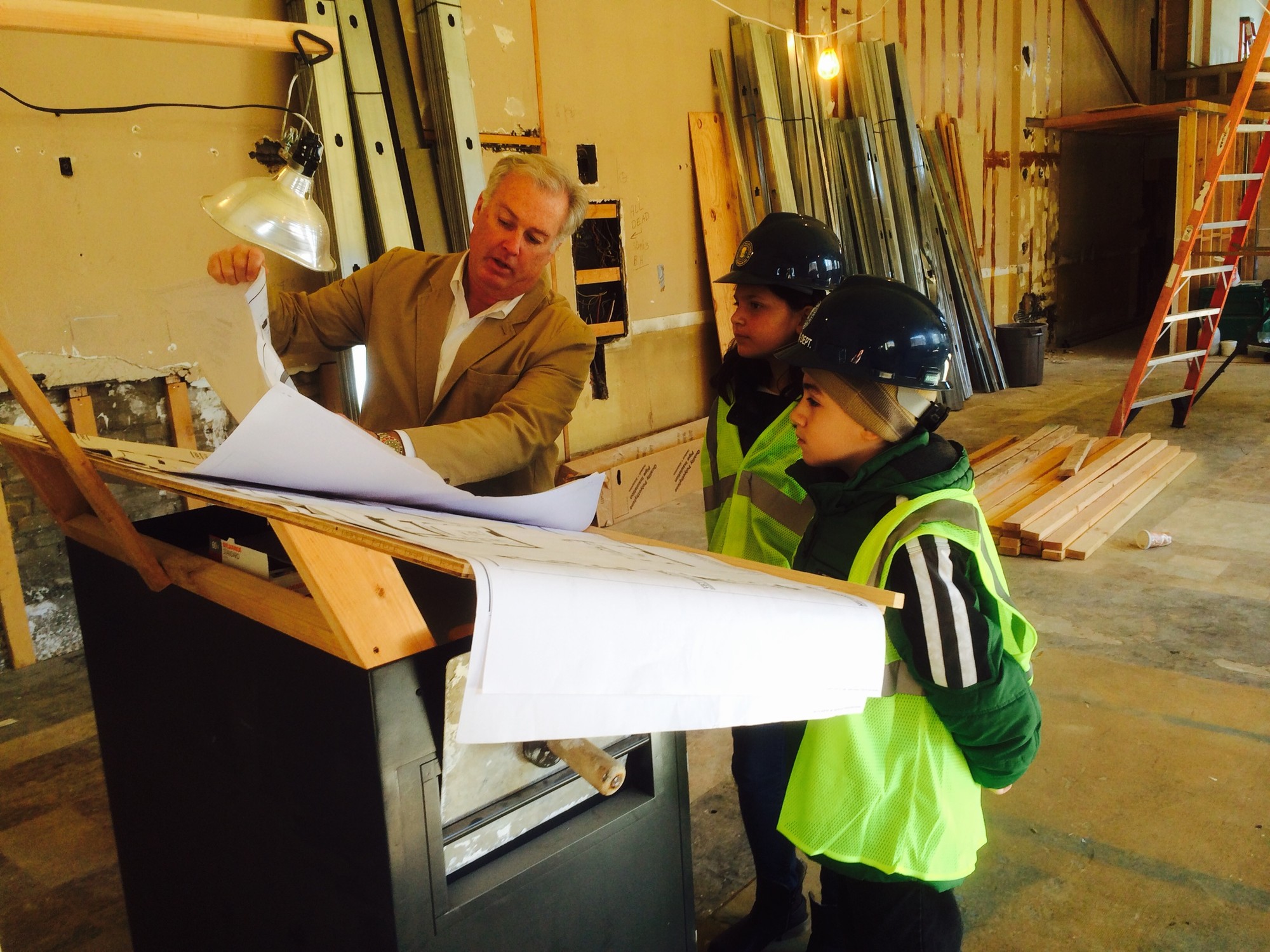 Superintendent of buildings Tom McAleer showed the young mayors the blueprints for the judge’s chambers and conference room on the upper floor of the new village courthouse on Rockaway Avenue.