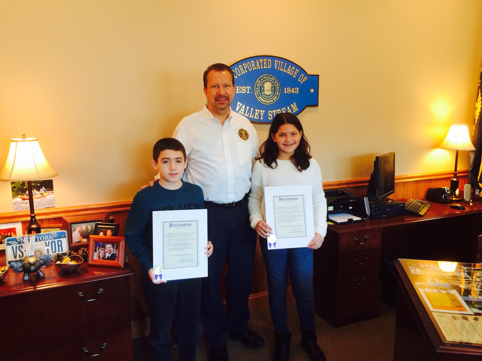 Valley Stream Mayor Ed Fare presented Brandon Dikeman, a sixth-grader at Holy Name of Mary School, and Lauren Flynn, a sixth-grader at Wheeler Avenue School, with proclamations officially naming the pair Mayors for a Day.