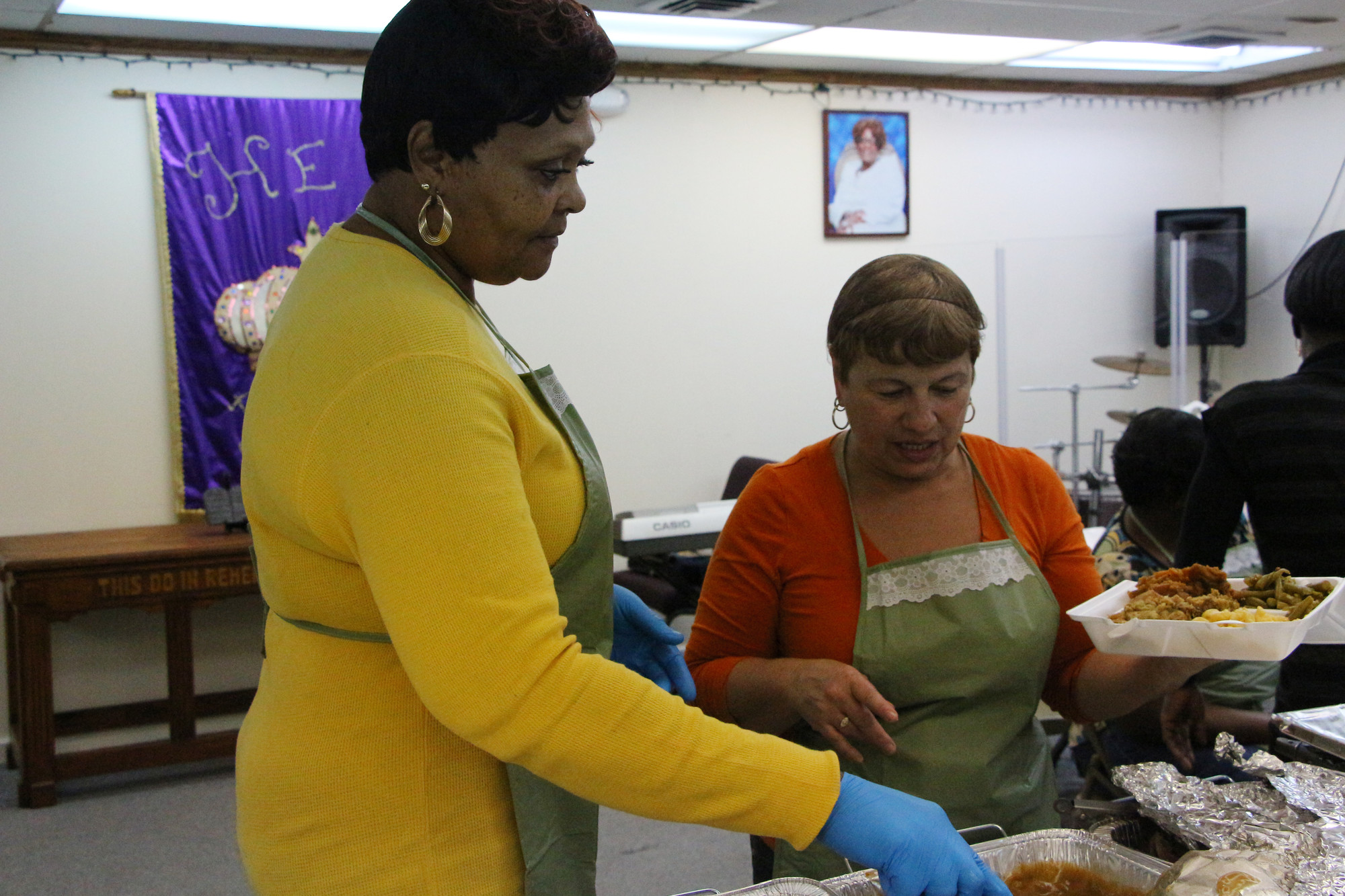 Evelyn Vaughan, left, and Raphaela Walker dished out some food to those in need.