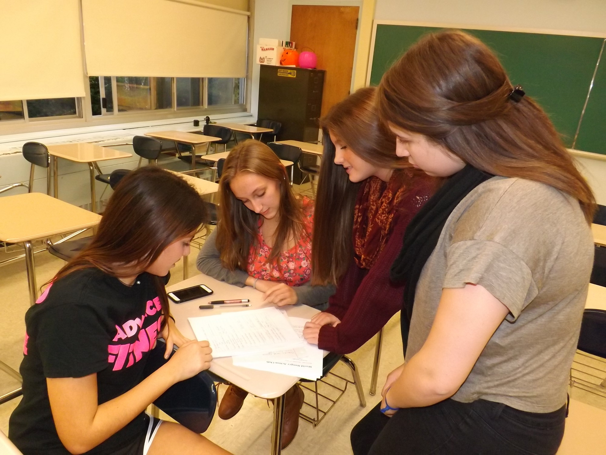 Senior officers Nicole Jaffe, at left, Kerri Percoco, Melissa Conway and Stephanie Lowe, all 17, agreed that volunteering at local soup kitchens has been an “eye-opening” experience.