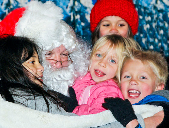 Santa was busy greeting children at the Baldwin Chamber of Commerce’s annual tree lighting ceremony in front of the Baldwin Historical Museum on Dec. 7. Seated on Santa’s lap, from left, were Rapsana Saragusa, 9, and Audrey and Declan Lozada, 6.