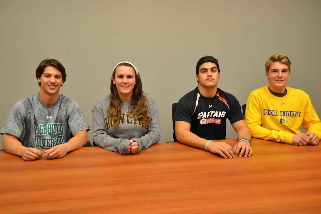 Max Willard, far left, Kelsey Larson, Nick Nigro, and Matt Varian recently signed letters of intent and committed to continue their athletic involvement in college.