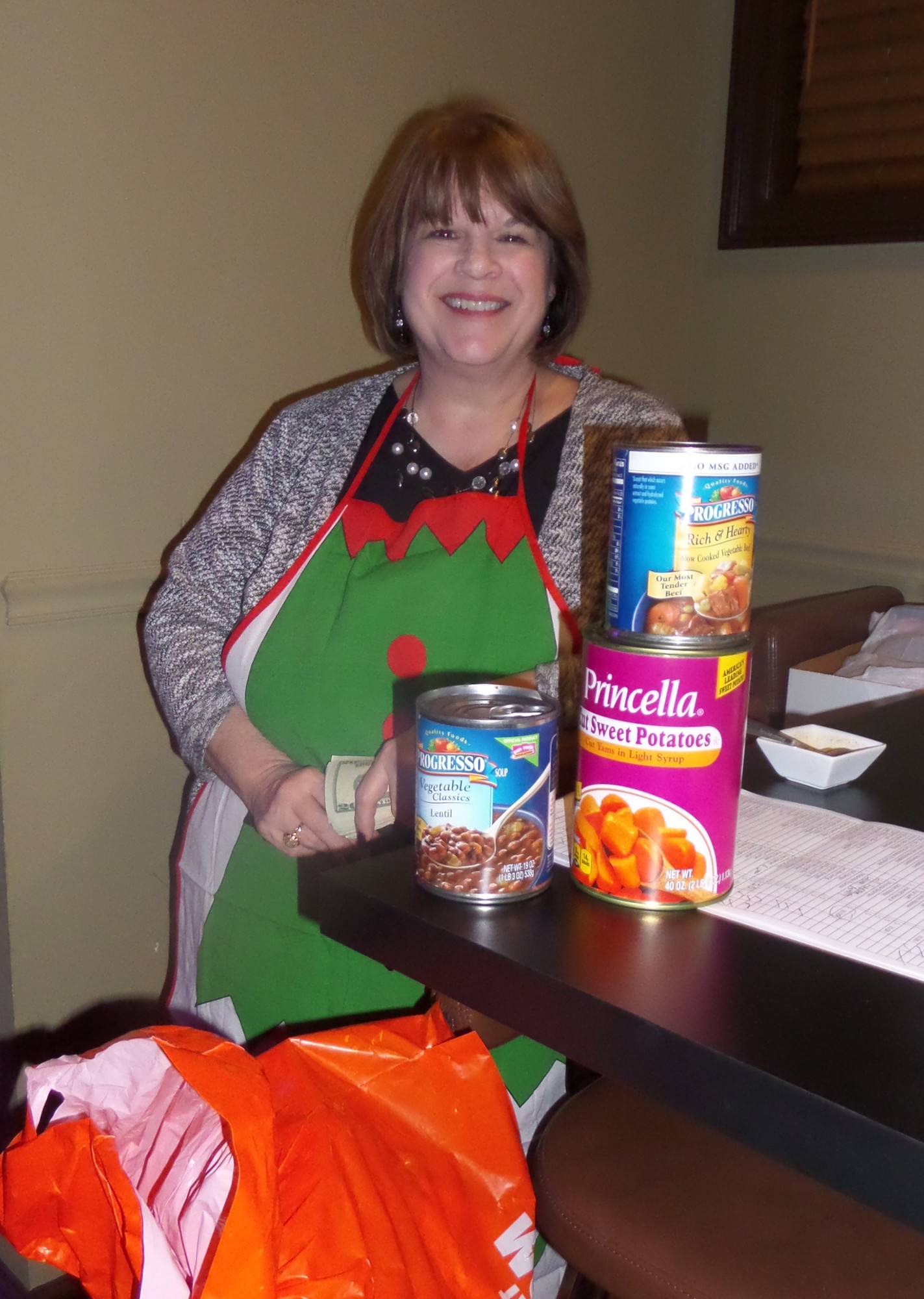 Santa’s helper Linda Stephenson collected donations of food at the door.