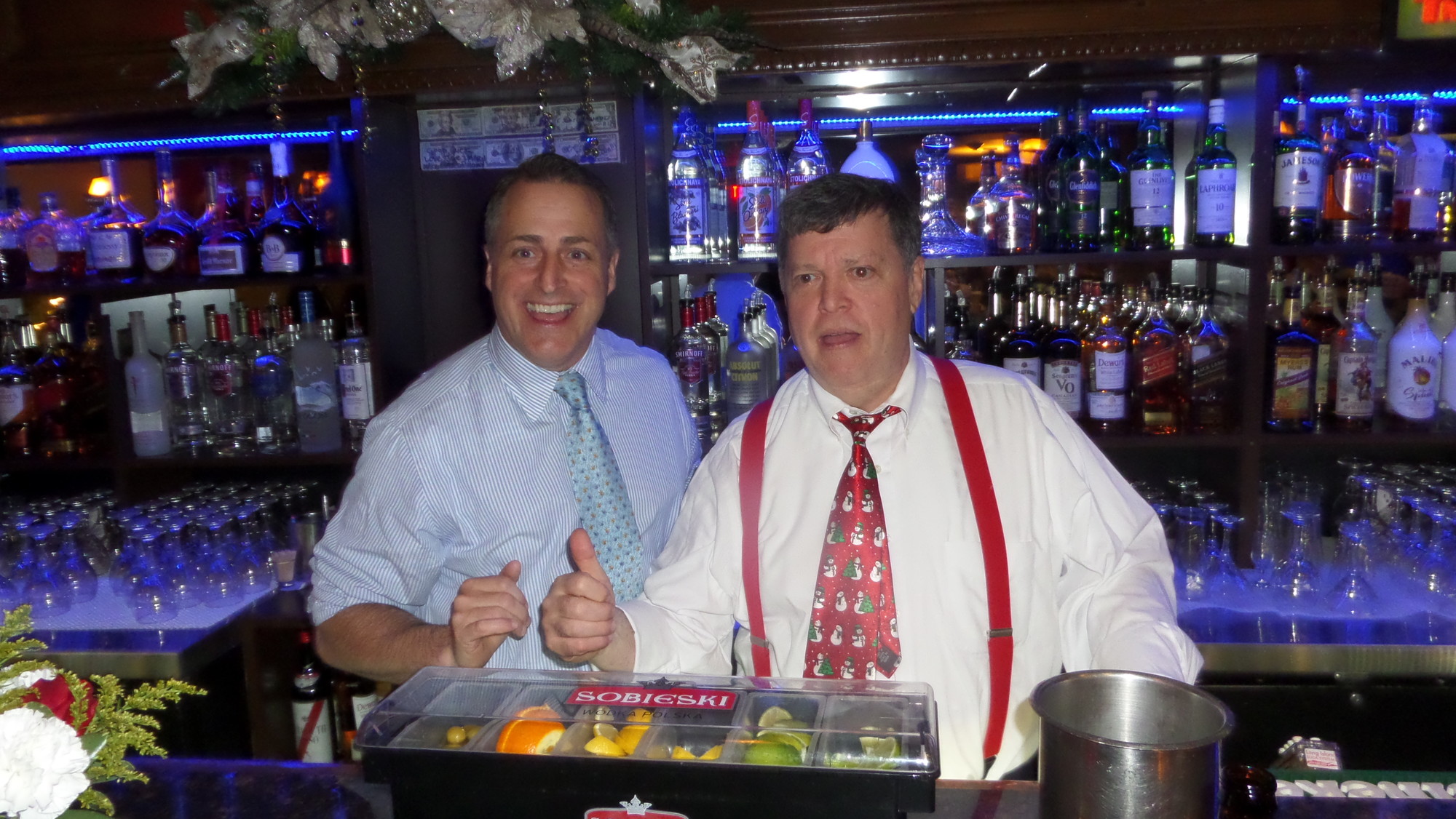 Assemblyman Brian Curran, left, and Lynbrook Mayor William Hendrick each claimed to be the one who raised the most tips for the evening.