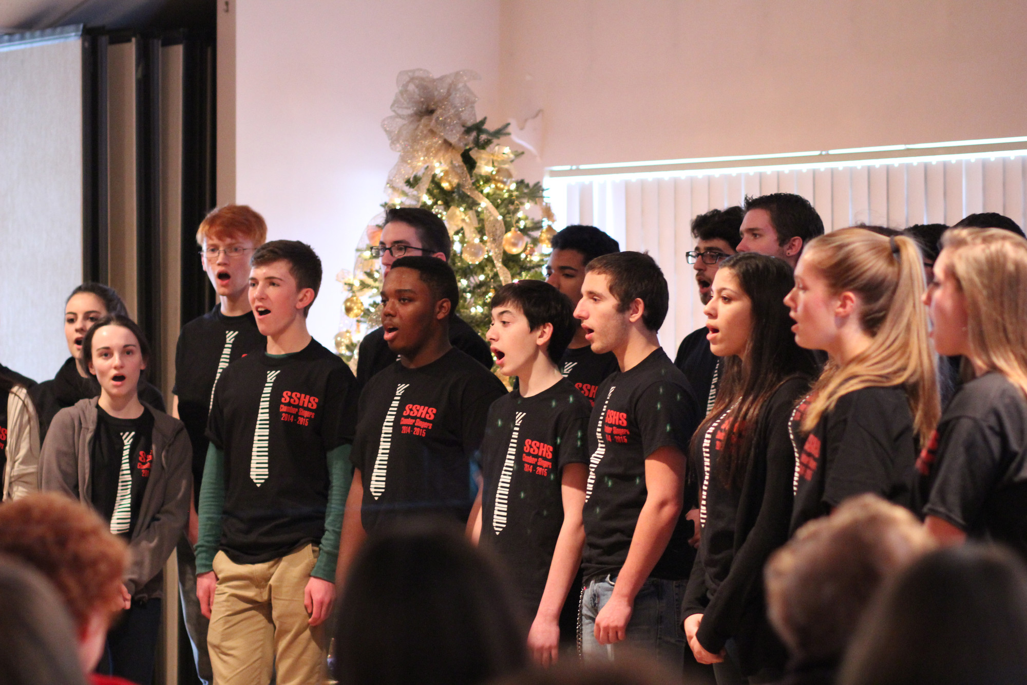 Students in the South Side High School Chamber Singers sang holiday songs for the Sandel members.
