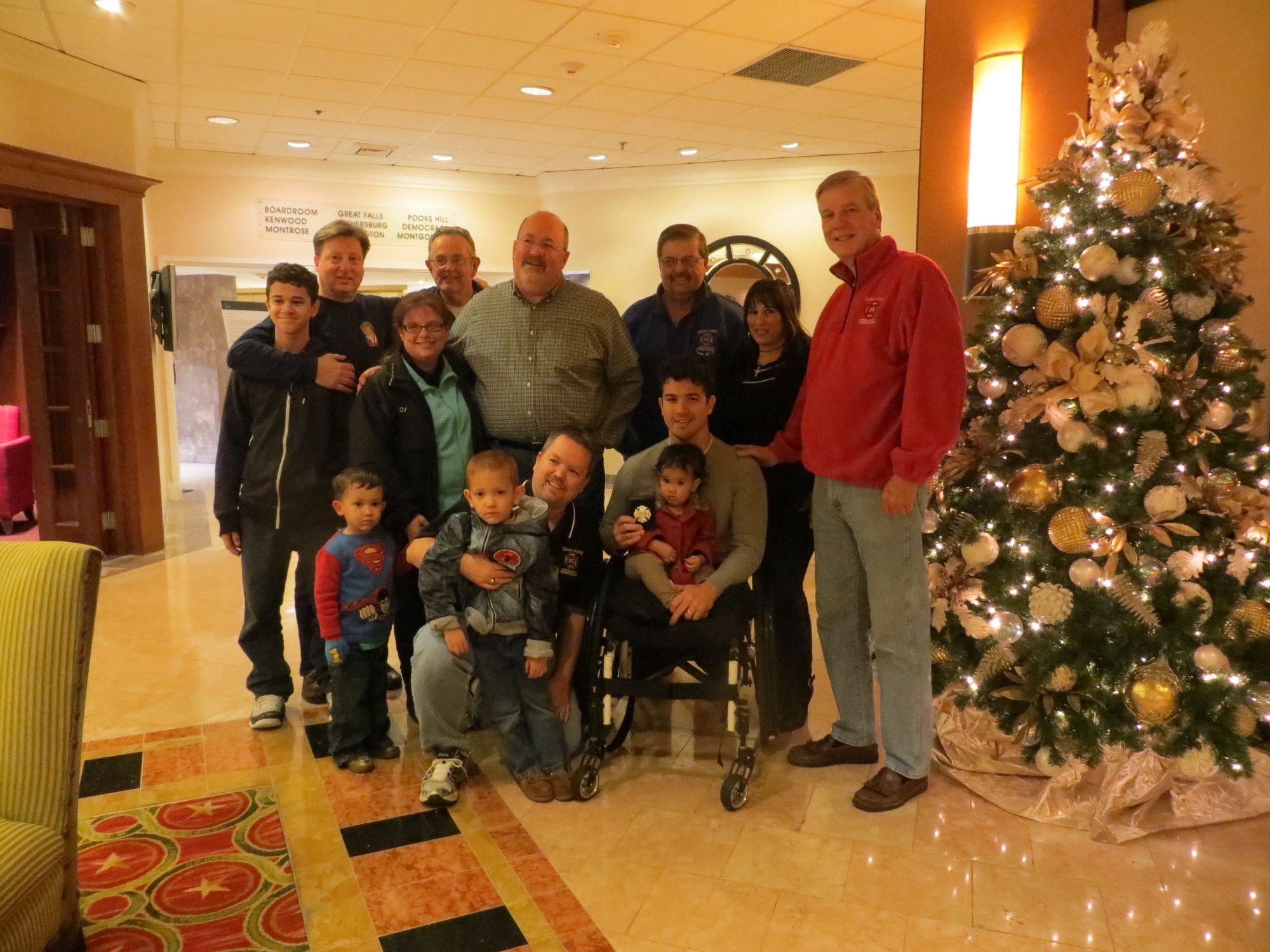 Lynbrook firefighters joined with Marcos Dandrea and his family around the Christmas tree.