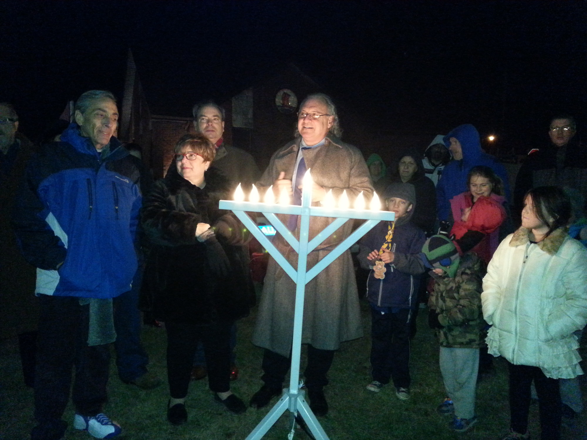 Rabbi Paul Hoffman lit the menorah last Saturday in Island Park.
