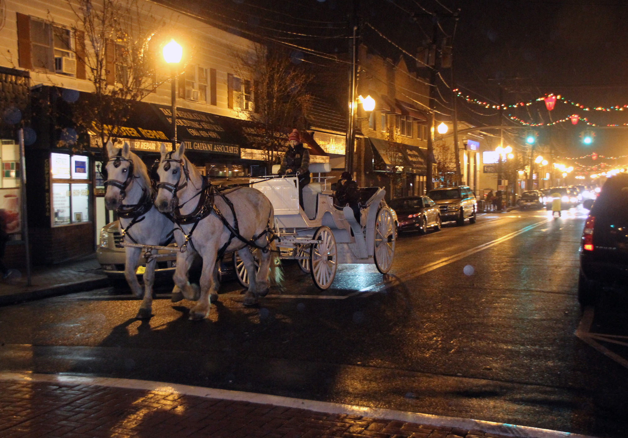 Folks rode around downtown Bellmore in a horse and carriage to check out lights 
displays.