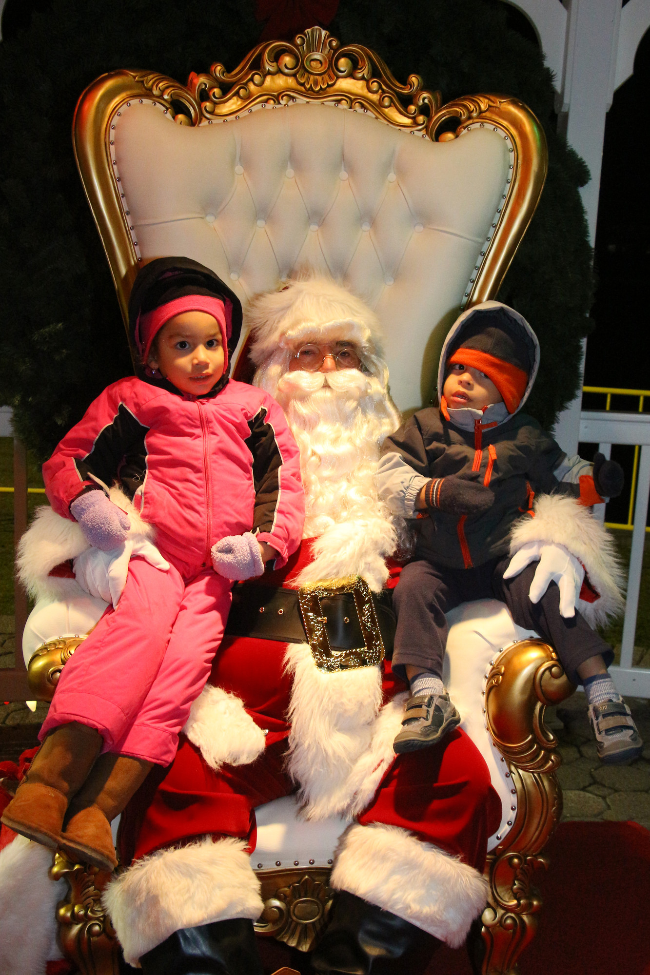Dahlia Corporan, 4, with her little brother Daniel, 2, sat on Santa’s lap last week.