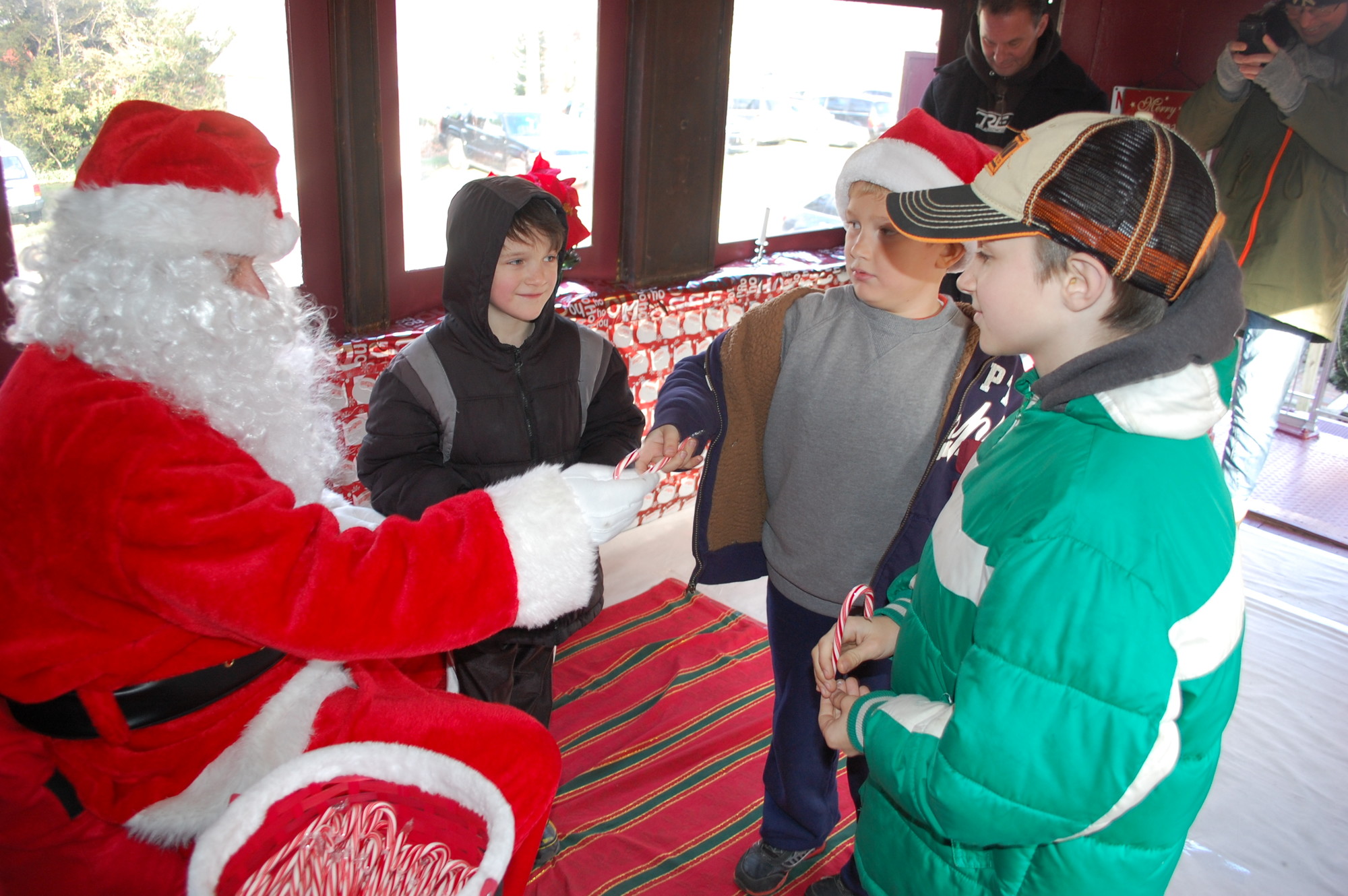 Santa received many visitors on Dec. 14, including Nikolas Boiko, 7, Chase Cates, 7, and Samuel Boiko, 9.
