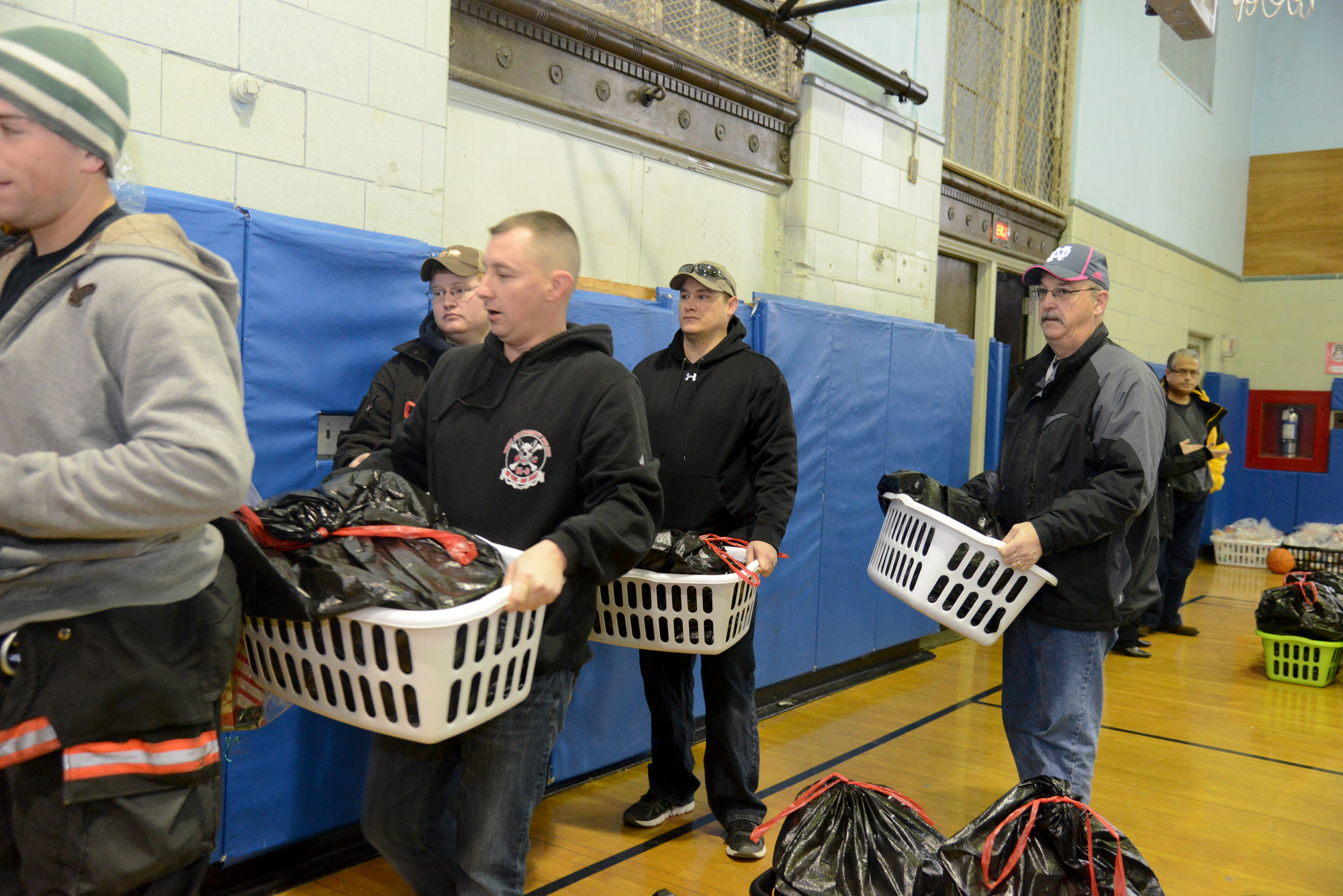From the Oceanside and Vestal Fire department —Mike Gress, Dusty McCartney, Kahl Miller, Bill Maguire — hauled baskets out of school 6 to be delivered