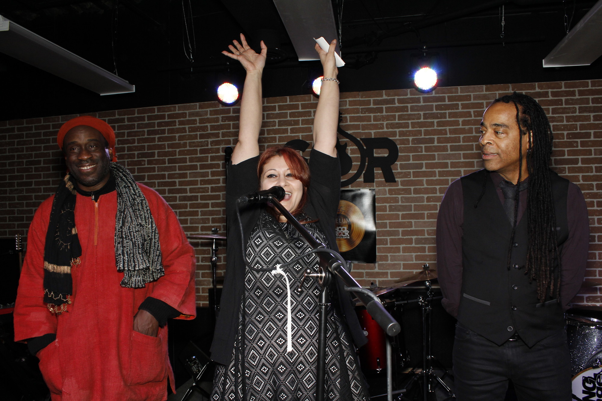 School of Rock owner Monica Rubin introduced Living Colour drummer Wil Calhoun, left, and bassist Doug Wimbish.