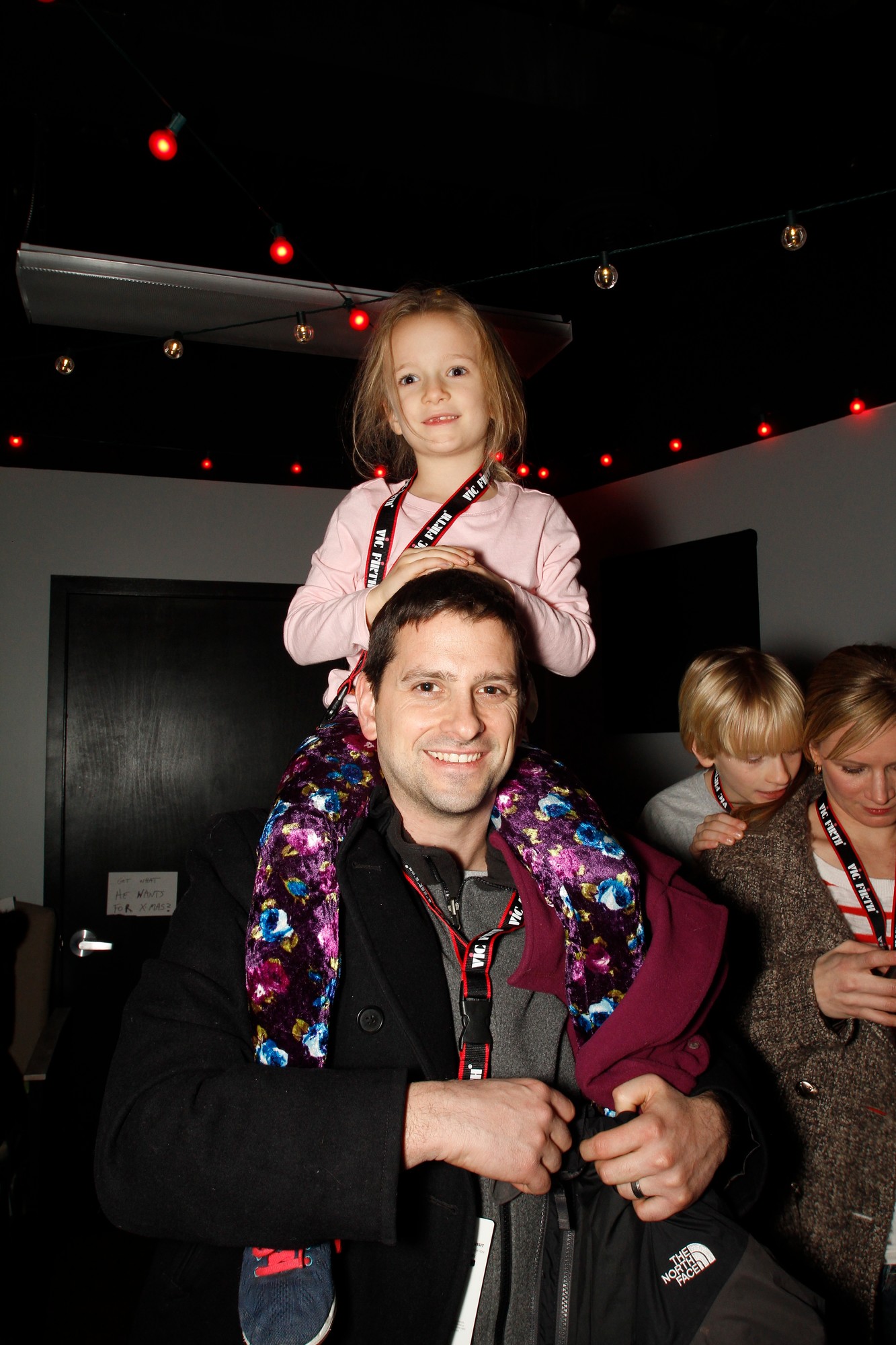 Elizabeth Hagan, 6, enjoyed the best seat in the house atop her dad, Brian.