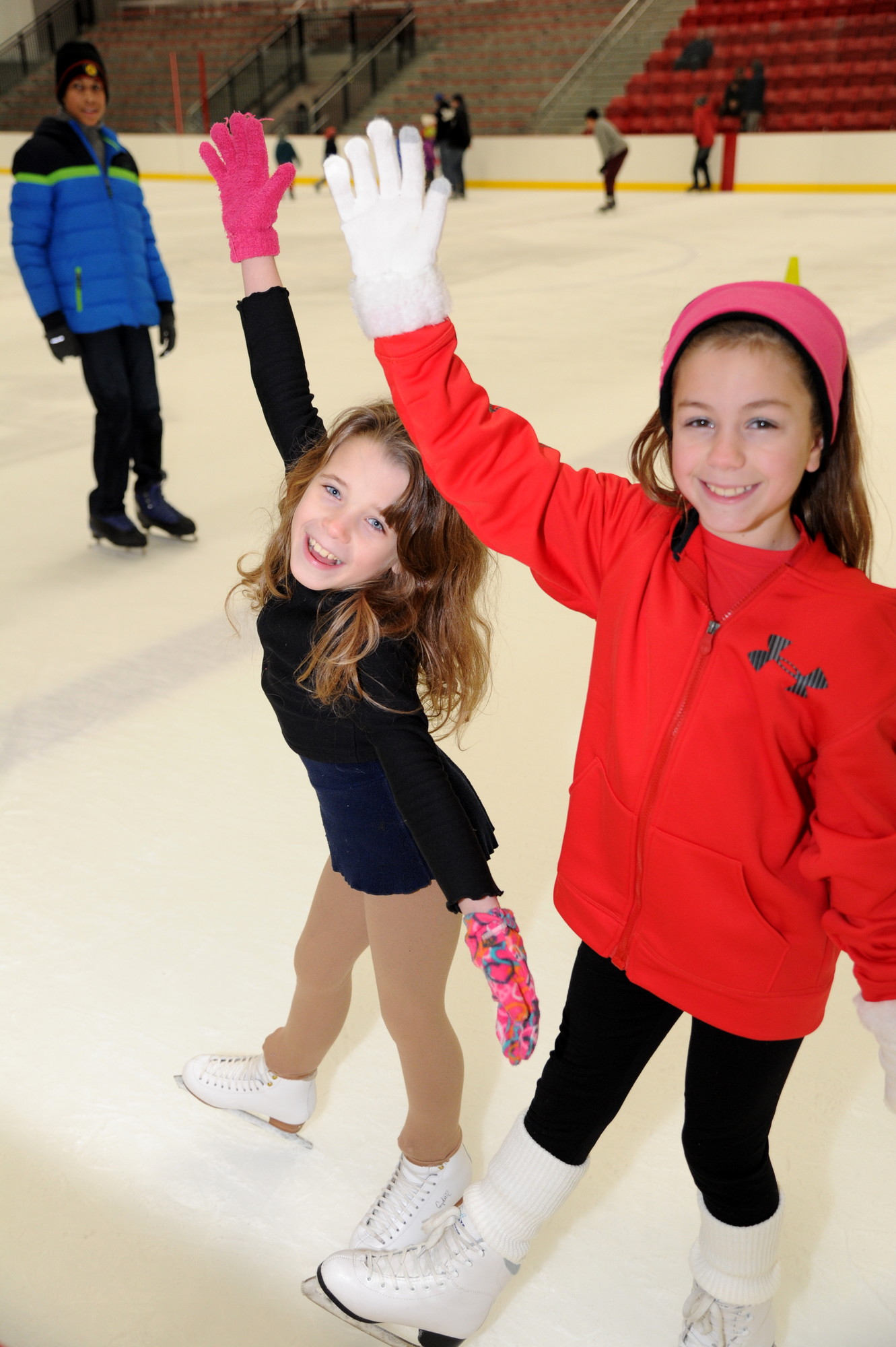 Kimberly Ovatia, 8, of East Meadow, left, and Samantha Yalvac, 10, skated by to say hello.