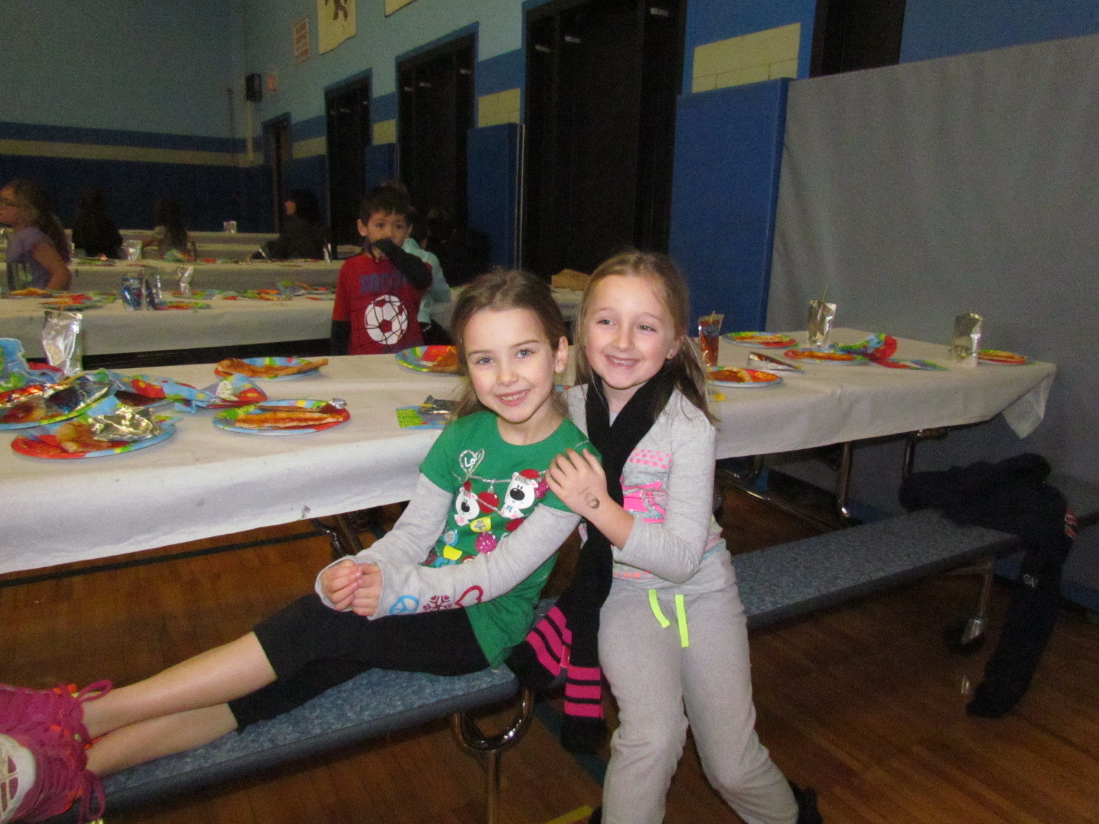 First graders Grace Furey and Brooke DeRespiris hung out during lunch.