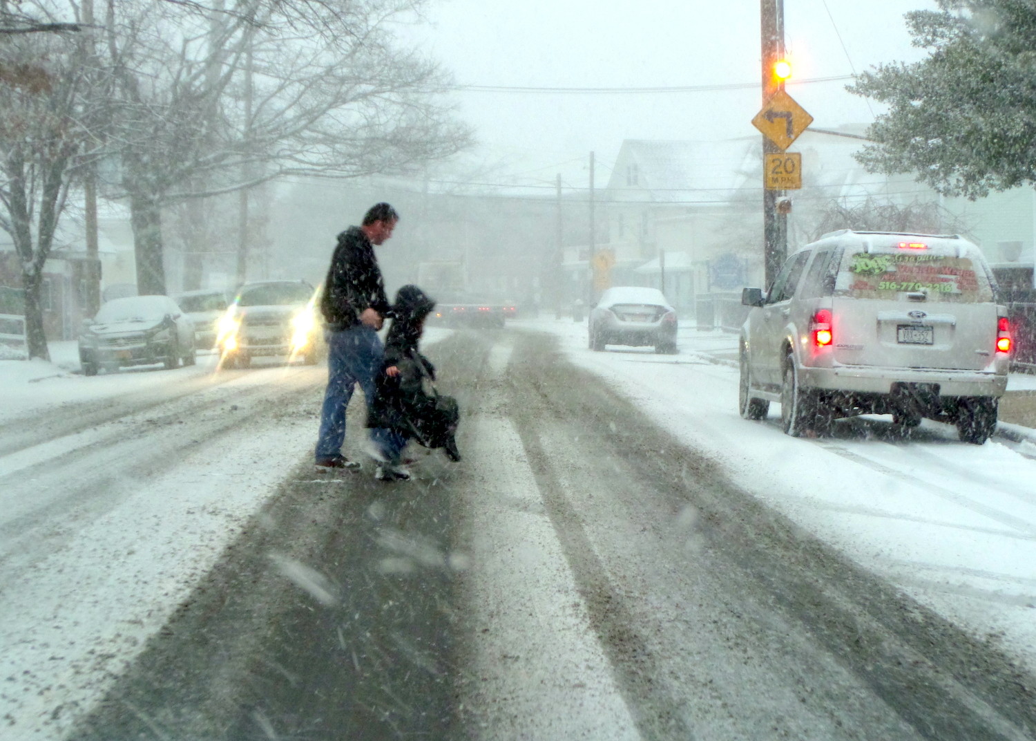 Snowy conditions made for slippery roads — but schools were still open in East Rockaway, Lynbrook, and other communities.
