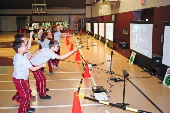 Third-graders at St. William the Abbot exercised using video games as iGame4 came to the school last week for the third consecutive year.