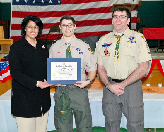 Anthony Teneriello was congratulated by his scoutmaster, Mark Sullivan, and Hempstead Town Clerk Nasrin Ahmad for earning his Eagle Scout award.