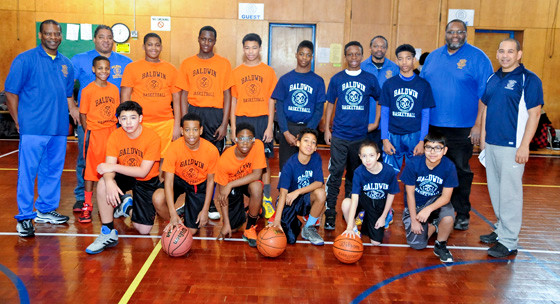 Two seventh and eighth-grade boys teams squared off last Saturday as part of the Baldwin Police Activity League basketball season. League Commissioner Rafael Crespo, far right, oversaw the action.